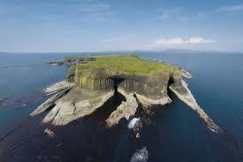 Staffa island cliffs surrounded by sea